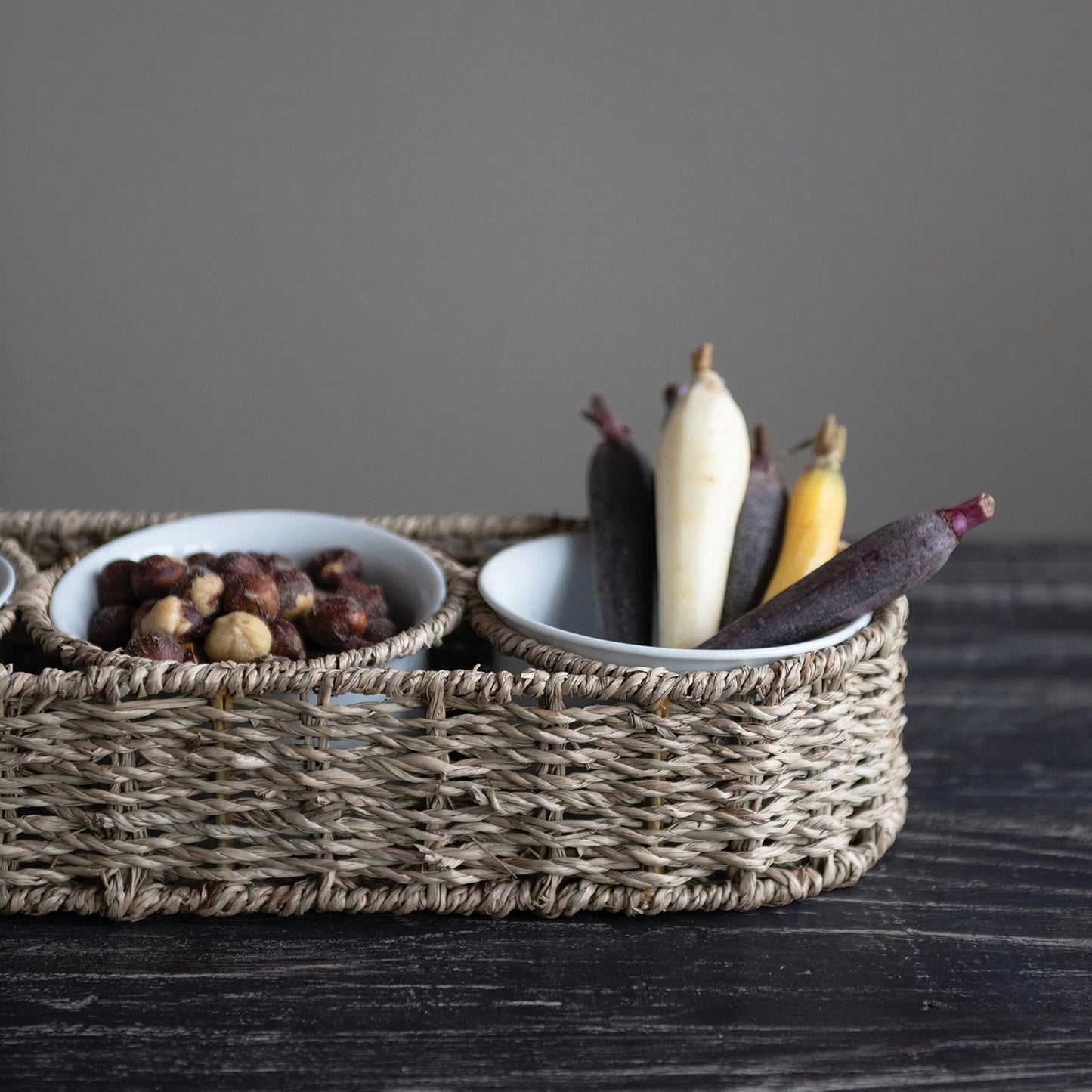 Woven basket with ceramic bowls