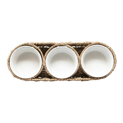 Woven basket with ceramic bowls